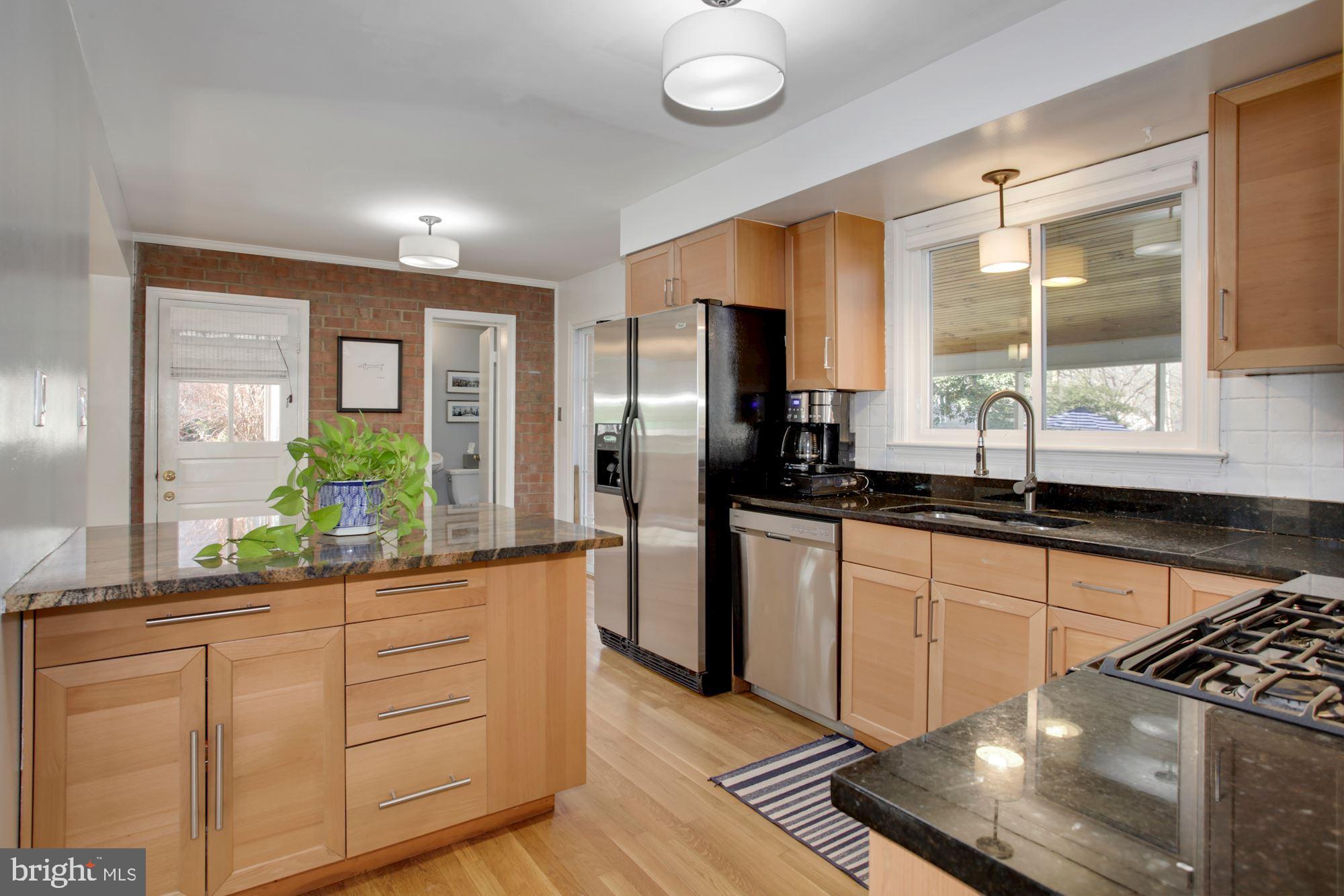 6618 Huntsman Boulevard Springfield, VA 22152 - Photo 3 of 20 Remodeled kitchen that leads to a dining room