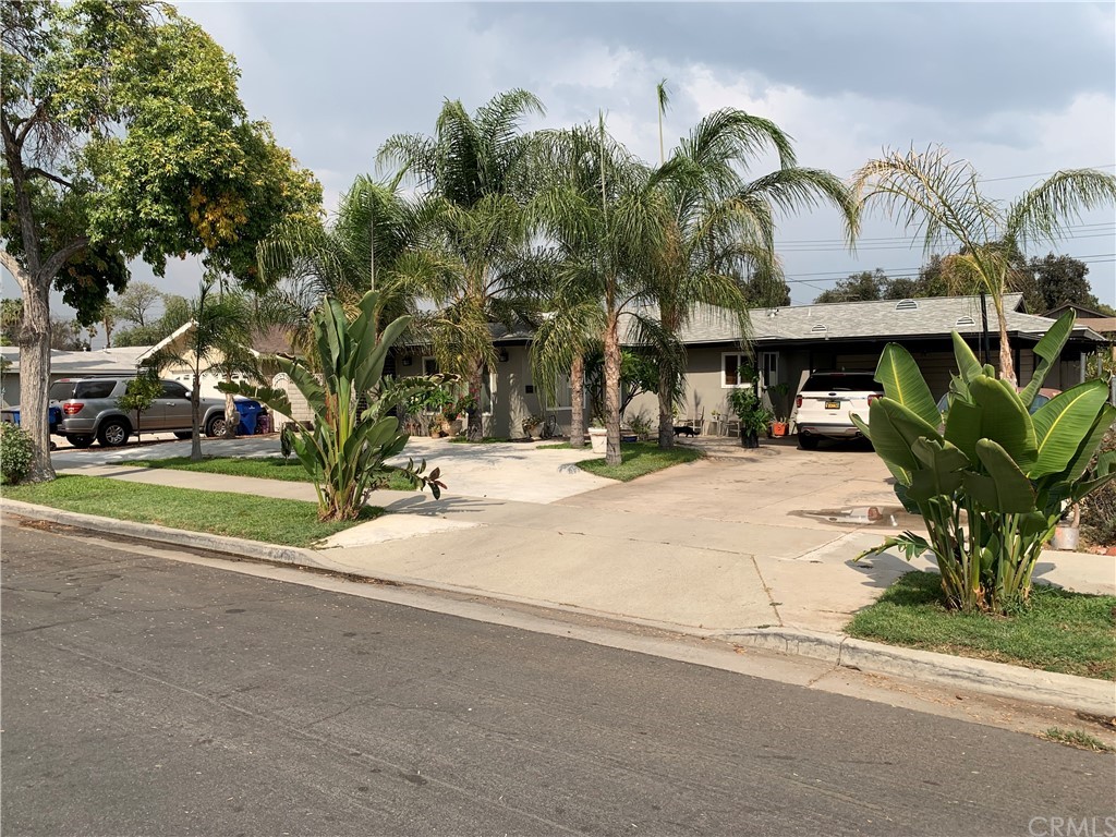 4375 Toyon Road Riverside, CA 92504 - Photo 1 of 1 a view of multi story residential apartment building with a yard and large trees