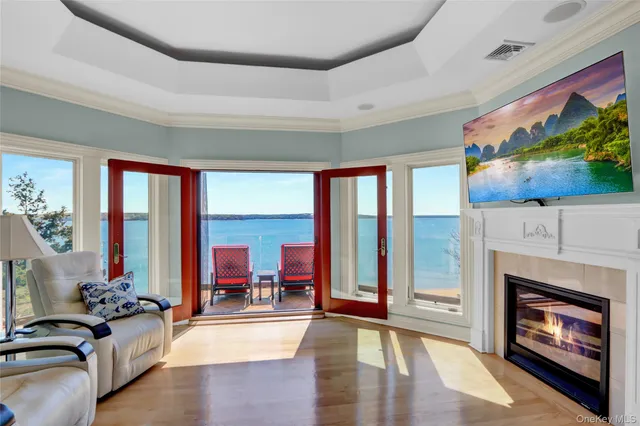 a living room with furniture fireplace and flat screen tv
