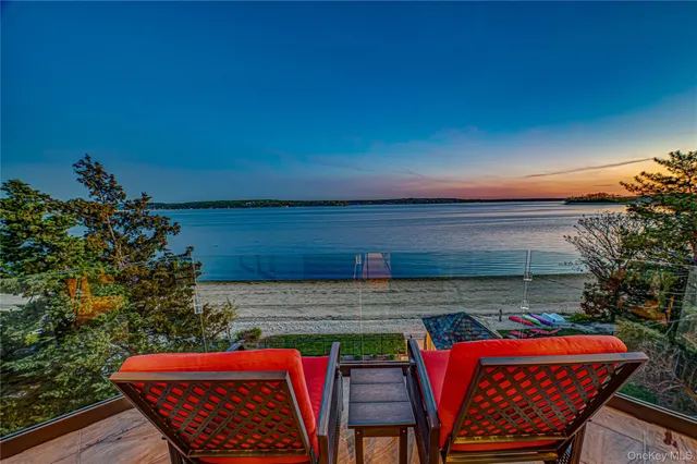 a view of patio with a table and chairs under an umbrella
