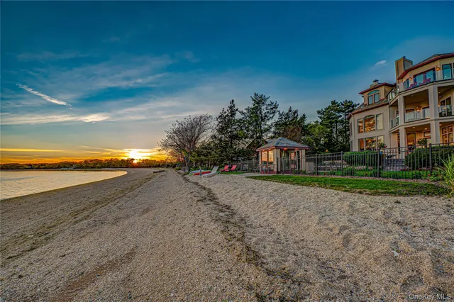 a view of an ocean with a building in the background