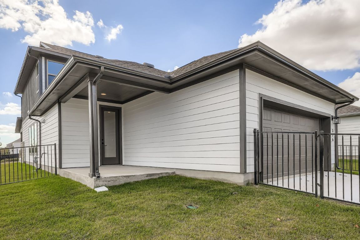 376 Orleanian Drive Buda, TX 78610 - Photo 2 of 10 a backyard of a house with lots of green space