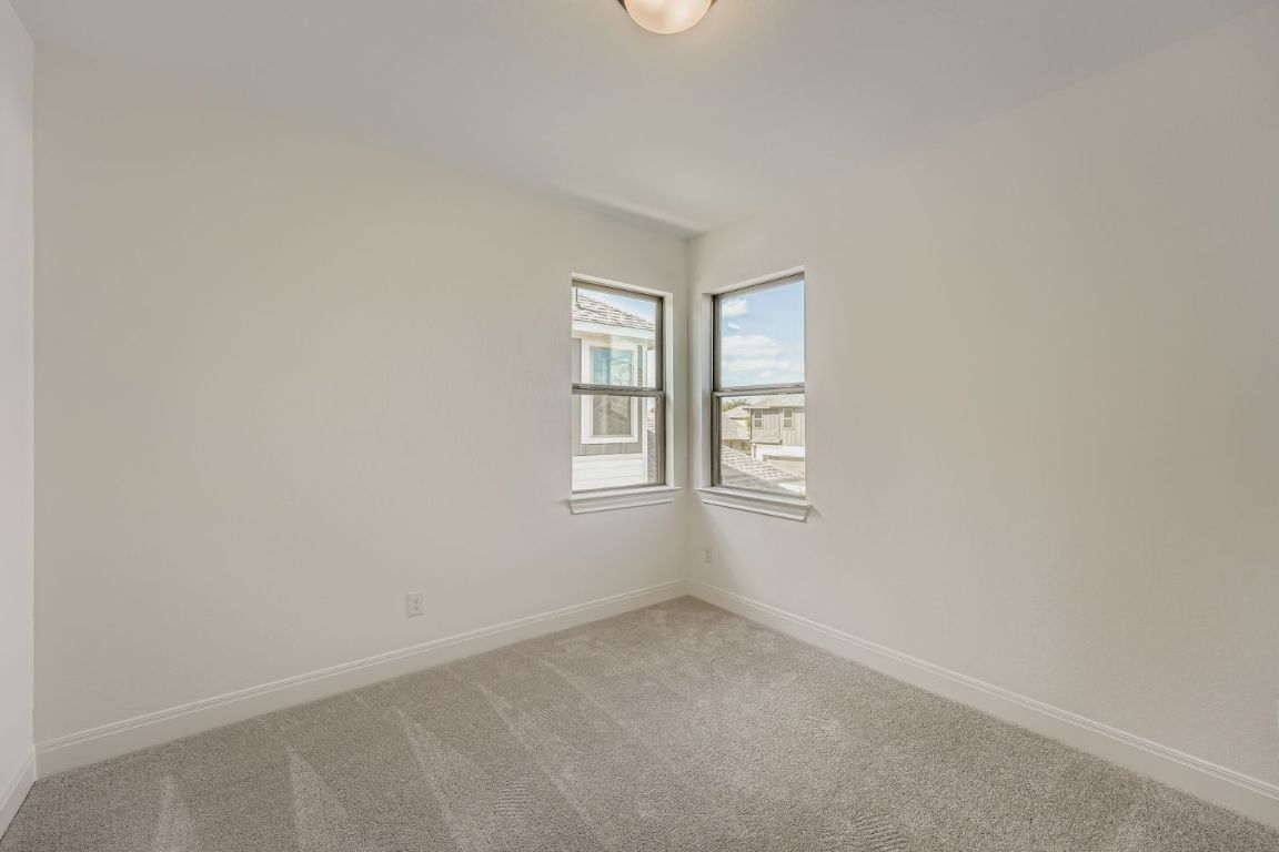 376 Orleanian Drive Buda, TX 78610 - Photo 8 of 10 an empty room with windows