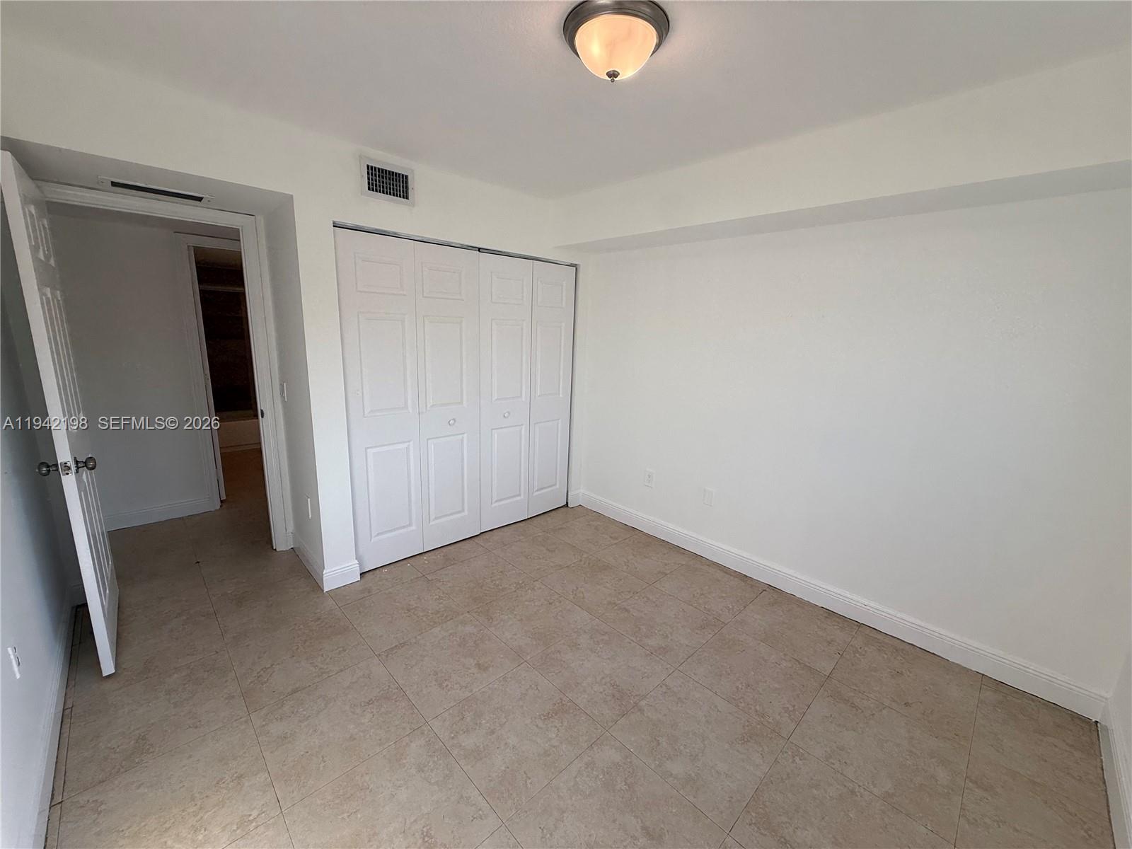 15460 Southwest 284th Street, Unit 4102 Homestead, FL 33033 - Photo 12 of 19 an empty room with closet