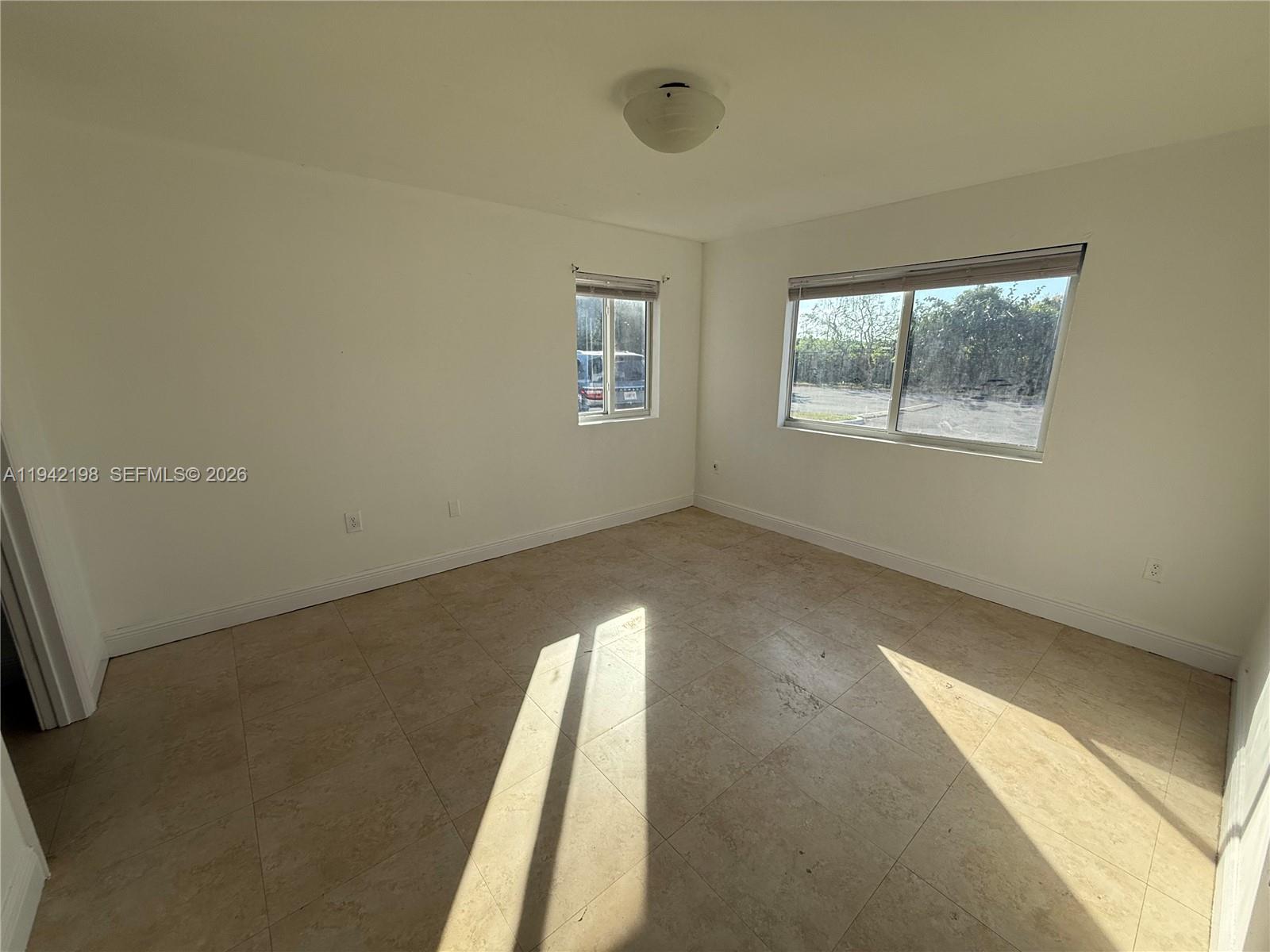 15460 Southwest 284th Street, Unit 4102 Homestead, FL 33033 - Photo 17 of 19 an empty room with a window
