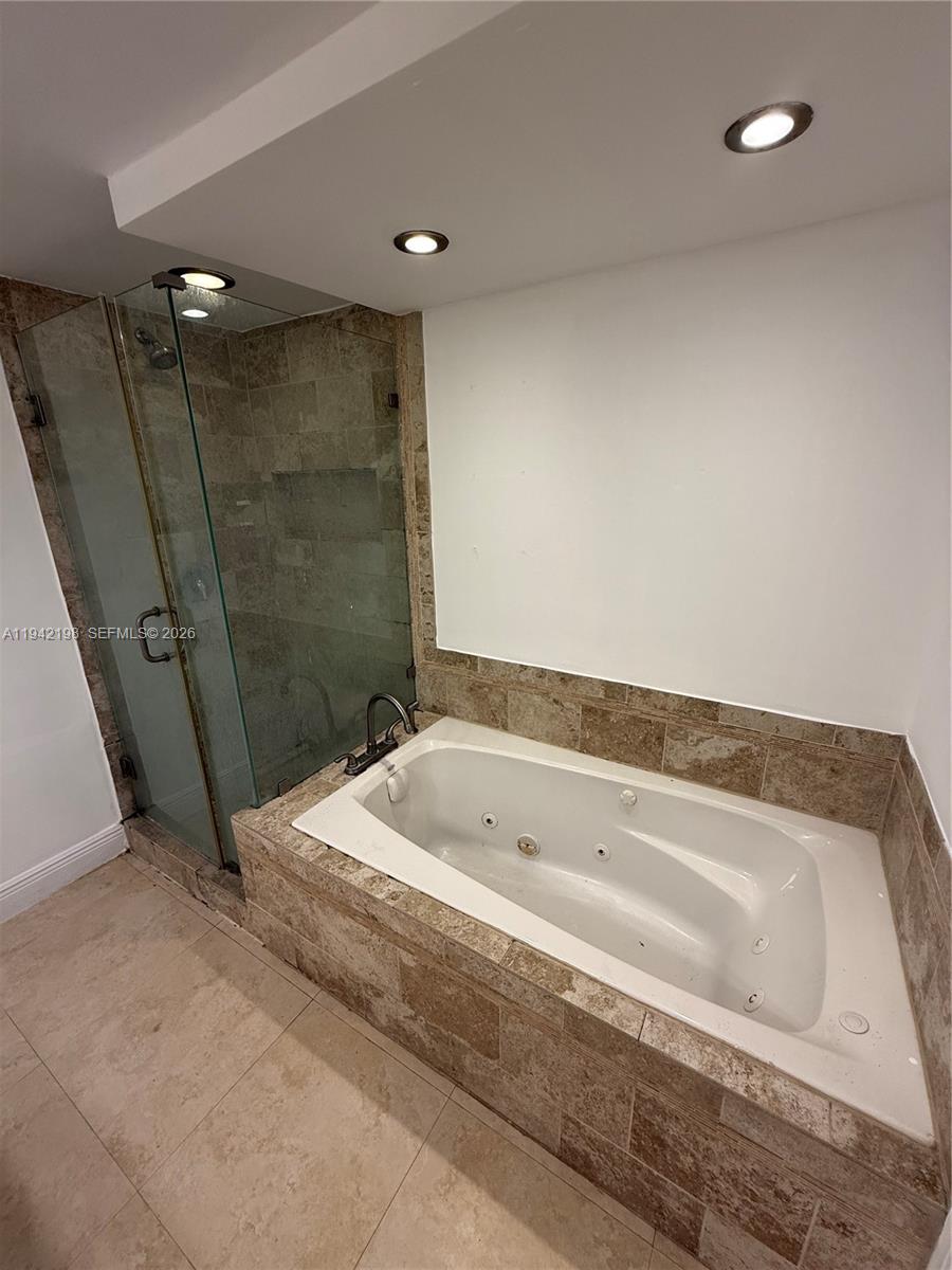 15460 Southwest 284th Street, Unit 4102 Homestead, FL 33033 - Photo 18 of 19 a bathroom with a tub a sink and shower