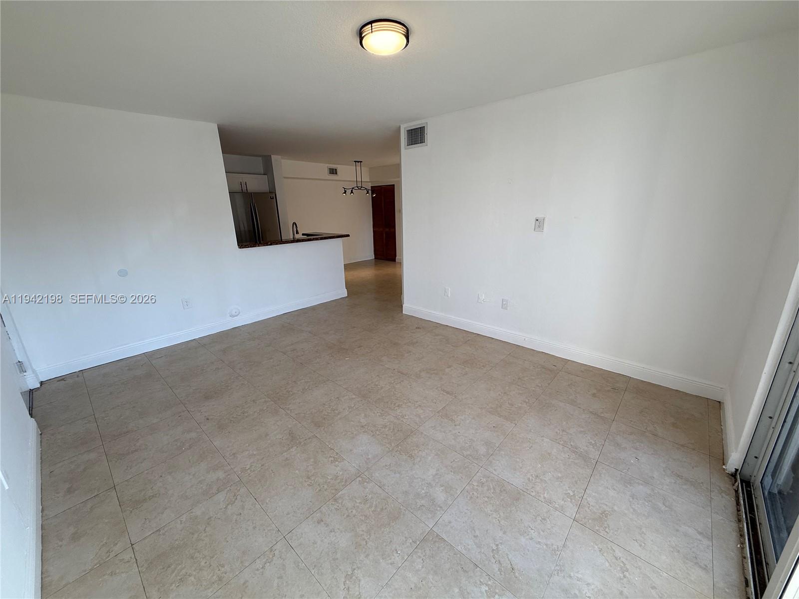 15460 Southwest 284th Street, Unit 4102 Homestead, FL 33033 - Photo 2 of 19 a view of a livingroom with a refrigerator
