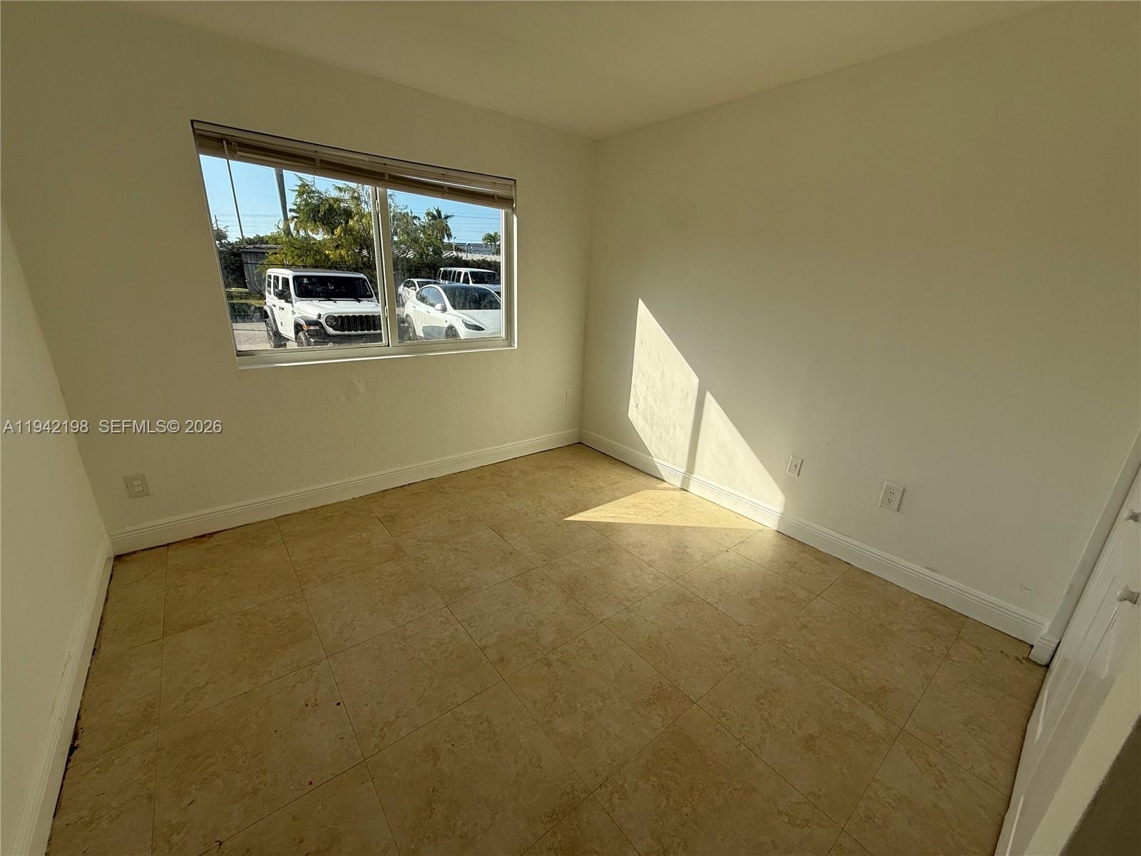 15460 Southwest 284th Street, Unit 4102 Homestead, FL 33033 - Photo 10 of 19 an empty room with windows