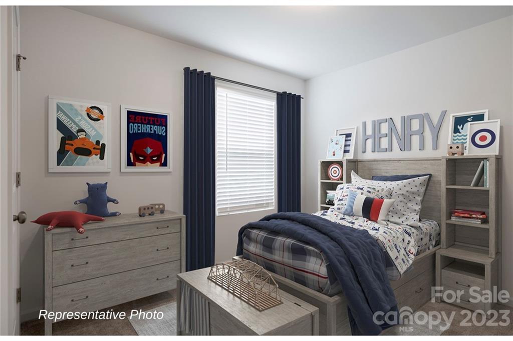 1244 Maple Shade Road Southwest, Unit 73 Concord, NC 28027 - Photo 11 of 12 a bedroom with a bed and furniture