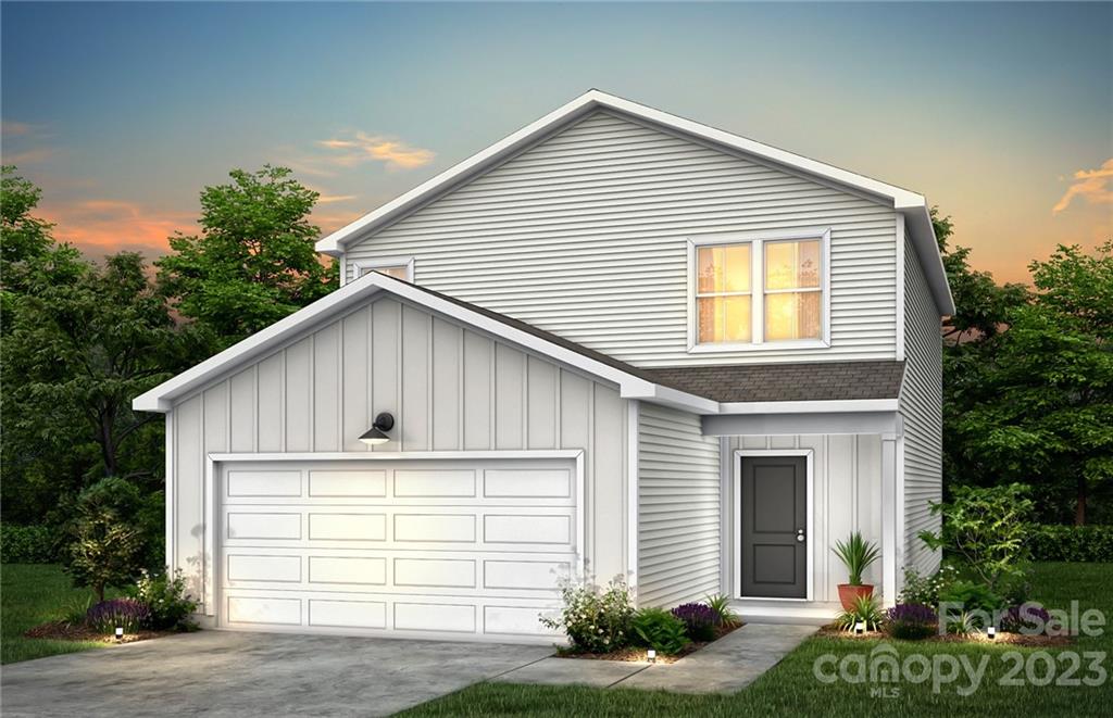 1244 Maple Shade Road Southwest, Unit 73 Concord, NC 28027 - Photo 2 of 12 a view of a house with a yard and garage