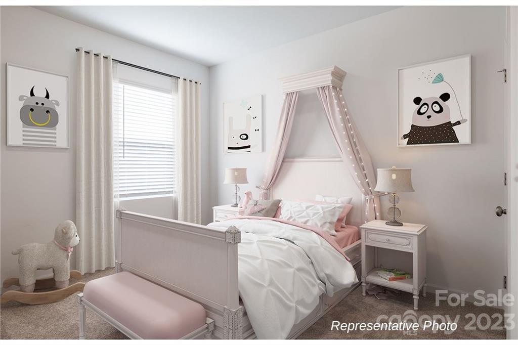 1244 Maple Shade Road Southwest, Unit 73 Concord, NC 28027 - Photo 9 of 12 a bedroom with a bed and a window