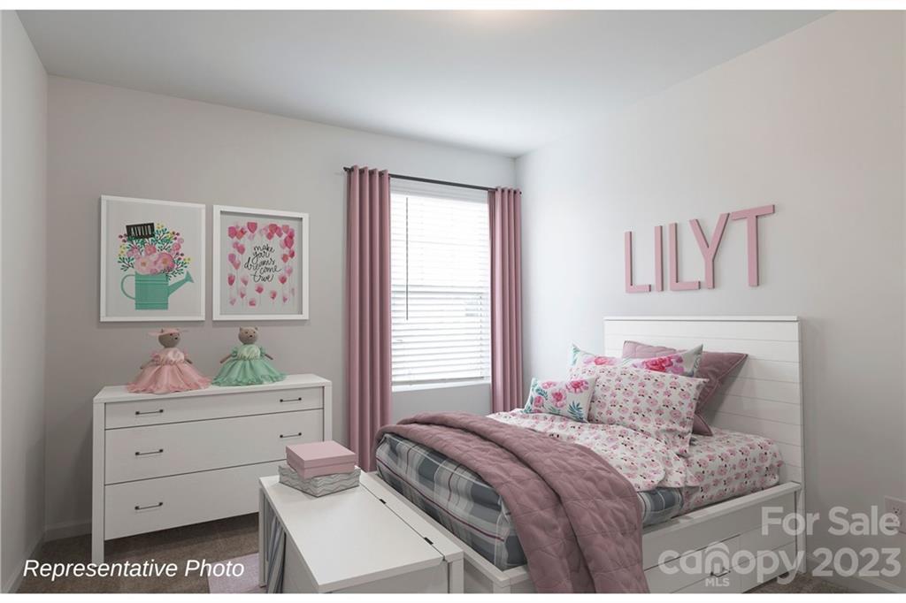 1244 Maple Shade Road Southwest, Unit 73 Concord, NC 28027 - Photo 10 of 12 a bedroom with a bed and a window