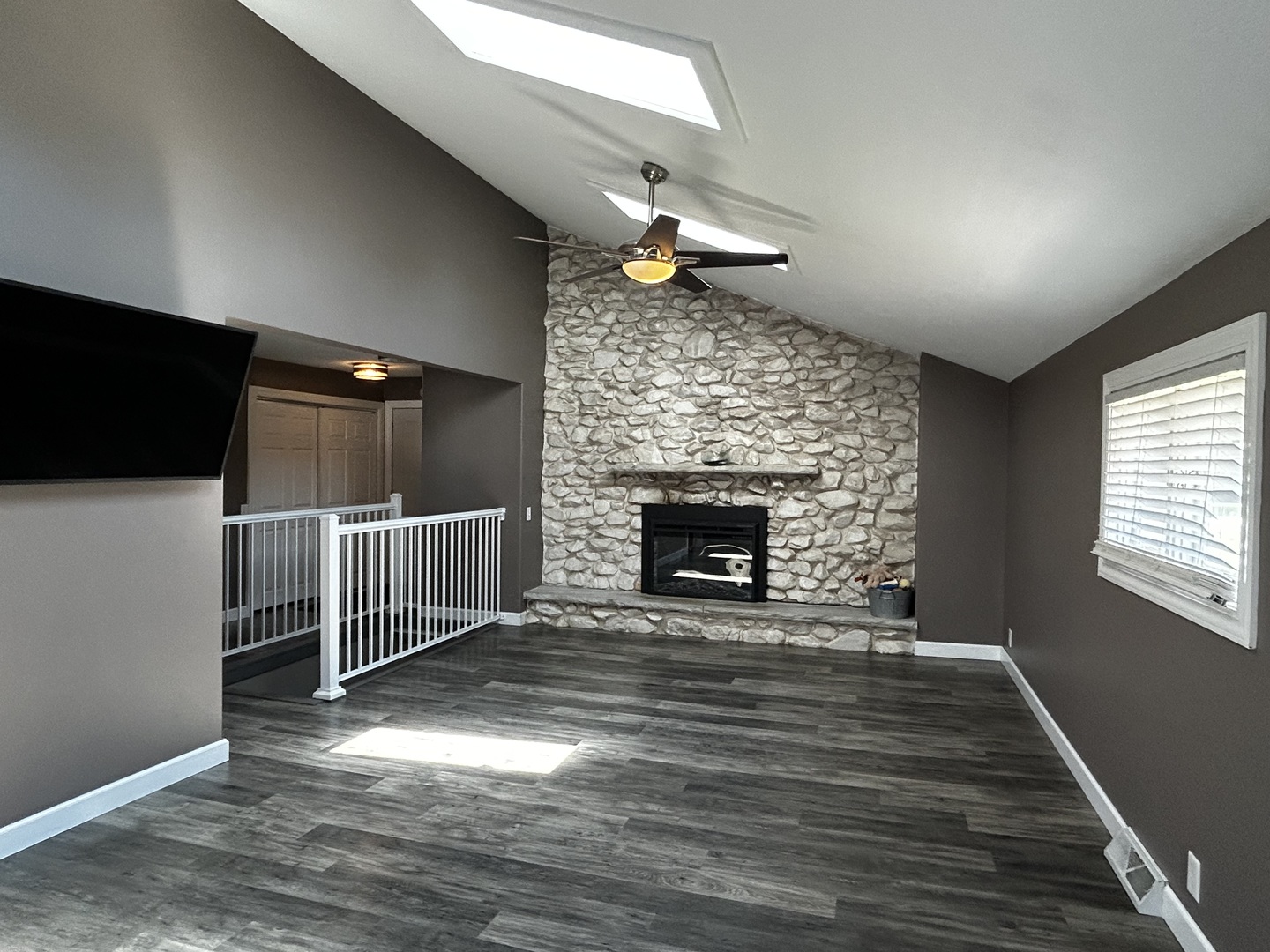 12795 Lawrence Road Sterling, IL 61081 - Photo 14 of 42 a view of empty room with wooden floor and fireplace