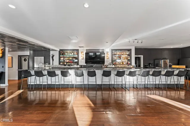 a dining room with furniture and wooden floor