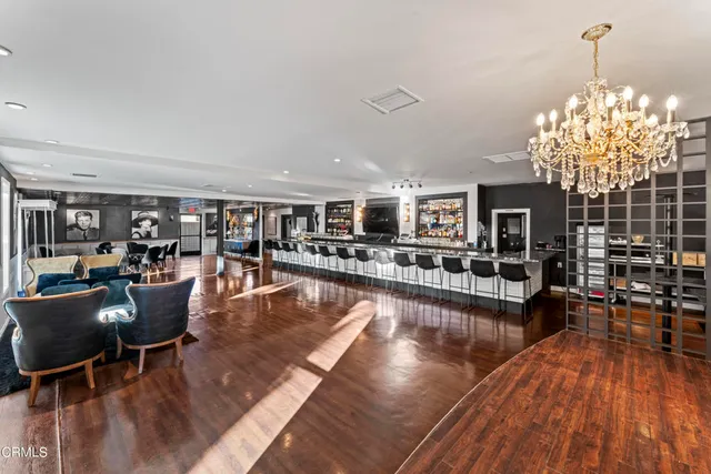 a view of a living room and kitchen floor