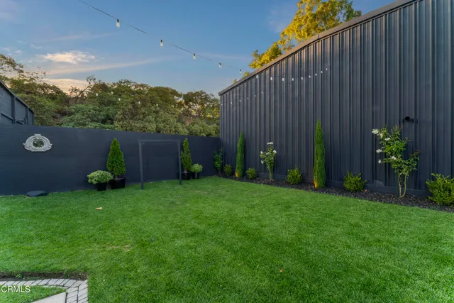 a view of a dining room with furniture and a window