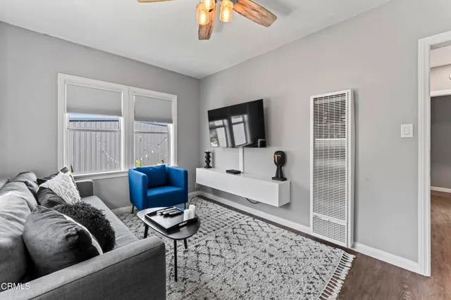 a bedroom with furniture and a chandelier