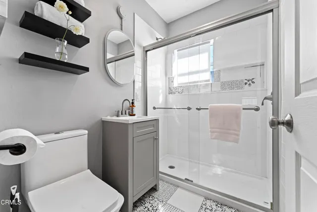 a view of a workspace with furniture and wooden floor