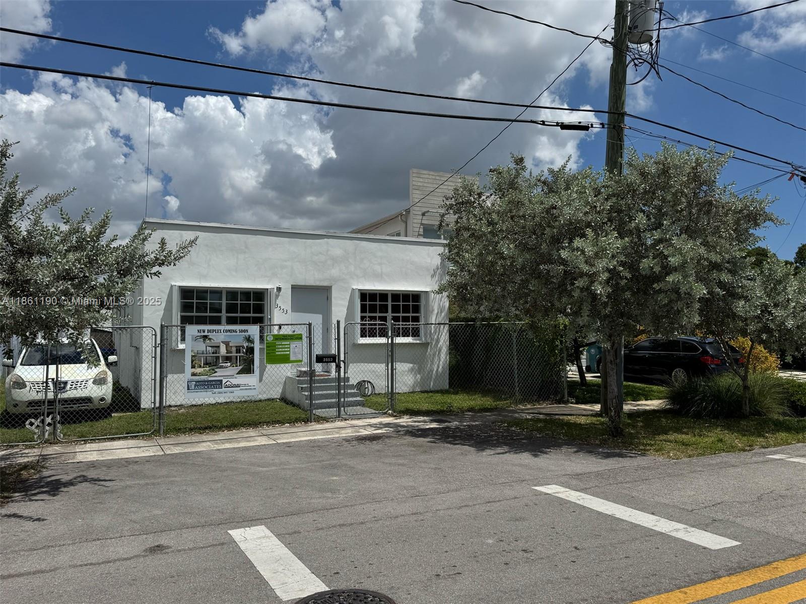 3553 Southwest 14th Street Miami, FL 33145 - Photo 12 of 12 a front view of a house with a yard