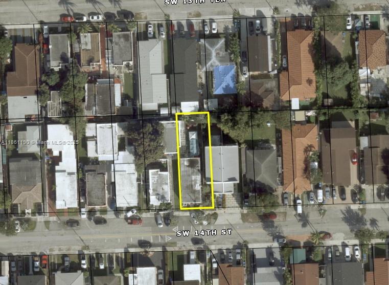 3553 Southwest 14th Street Miami, FL 33145 - Photo 8 of 12 a city street filled with lots of tall buildings