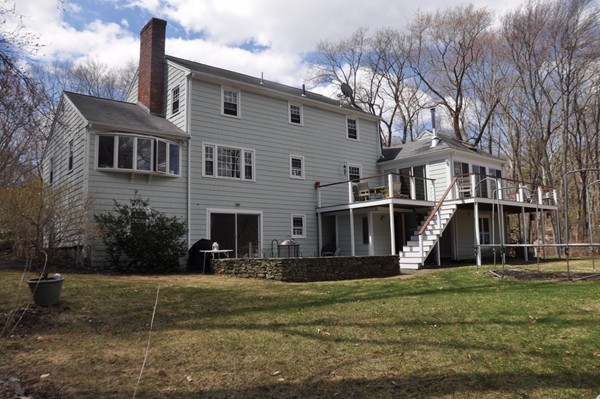18 Riga Road Dover, MA 02030 - Photo 22 of 24 a front view of a house with a yard