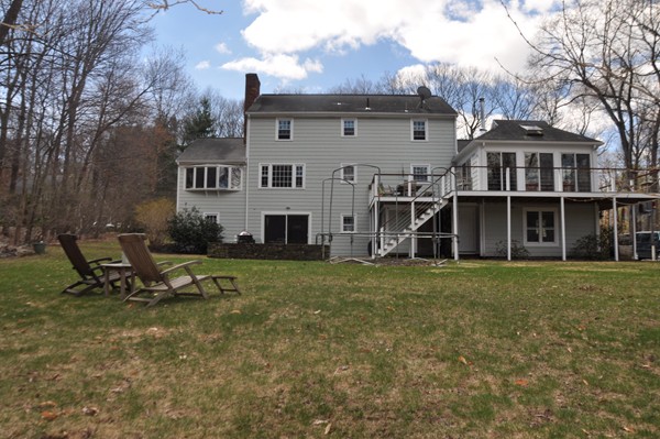 18 Riga Road Dover, MA 02030 - Photo 3 of 24 a front view of a house with a garden