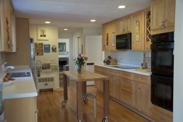 18 Riga Road Dover, MA 02030 - Photo 8 of 24 a kitchen with kitchen island granite countertop a sink appliances and cabinets