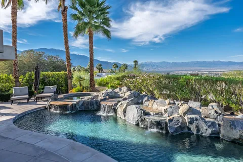 a view of kitchen with refrigerator and stove