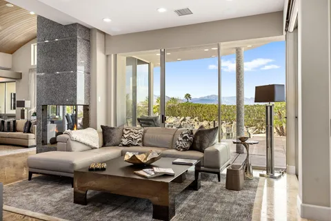 a large white kitchen with a large window