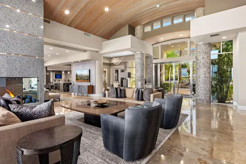 a bathroom with a granite countertop sink a toilet and shower