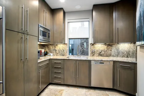 a view of a patio with table and chairs with wooden floor and fence