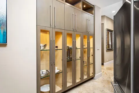 a building outdoor space with patio furniture and potted plants