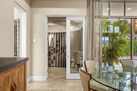 a view of a lush green forest with mountains in the background