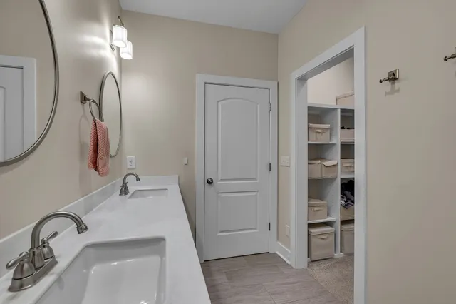 a bathroom with a sink and a mirror