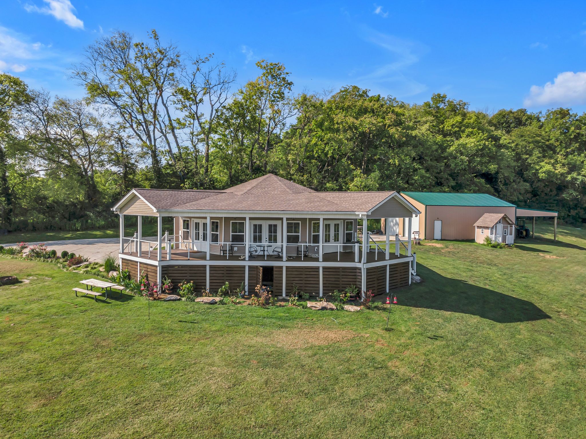 2770 East Sheepneck Road Culleoka, TN 38451 - Photo 19 of 49 a front view of a house with a garden