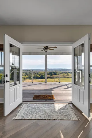 a view of porch with wooden floor