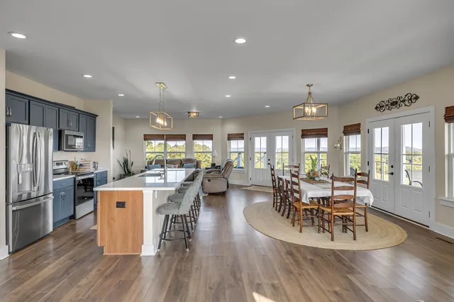 a view of a dining room with furniture window and wooden floor