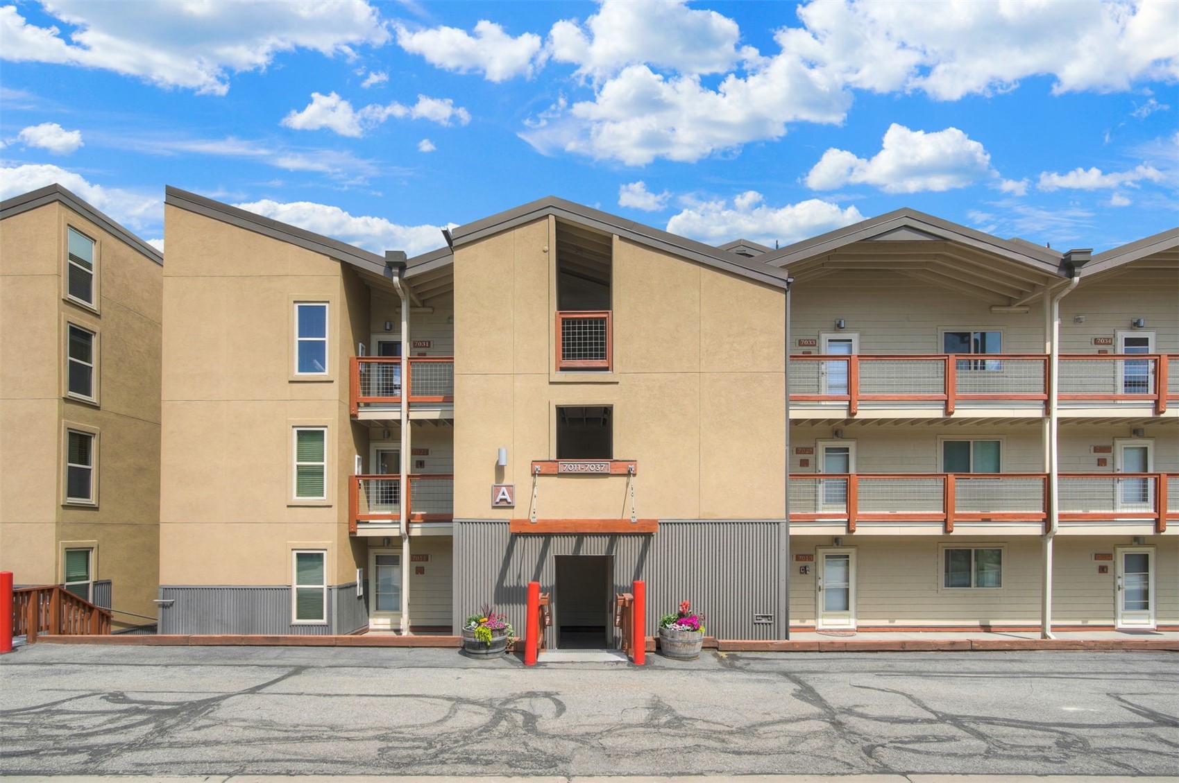 7031 Ryan Gulch Road, Unit 301 Silverthorne, CO 80498 - Photo 3 of 37 a view of a building with a terrace