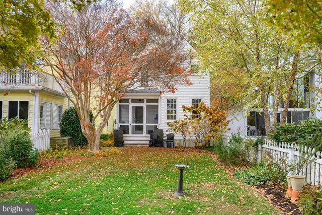 a view of an entryway with wooden floor and stairs