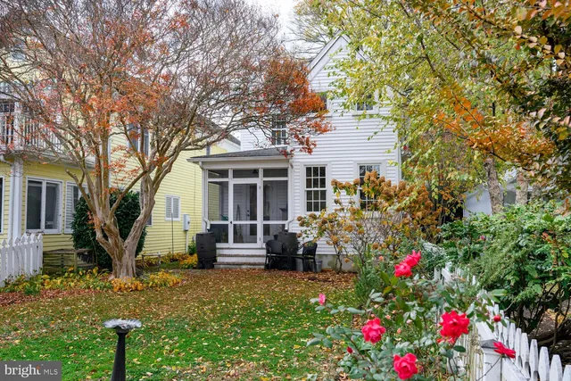 a living room with furniture a rug and a flat screen tv