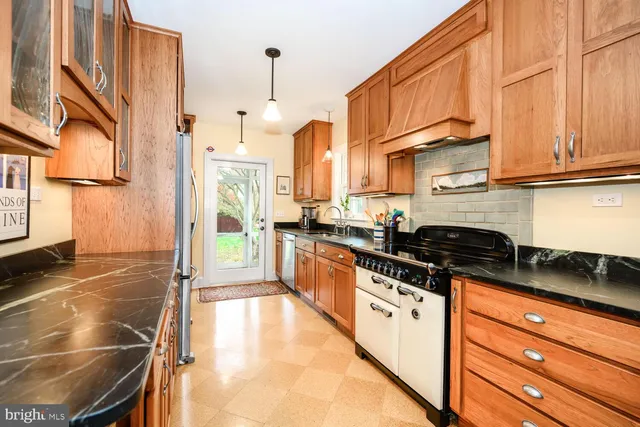 a room with furniture and two windows