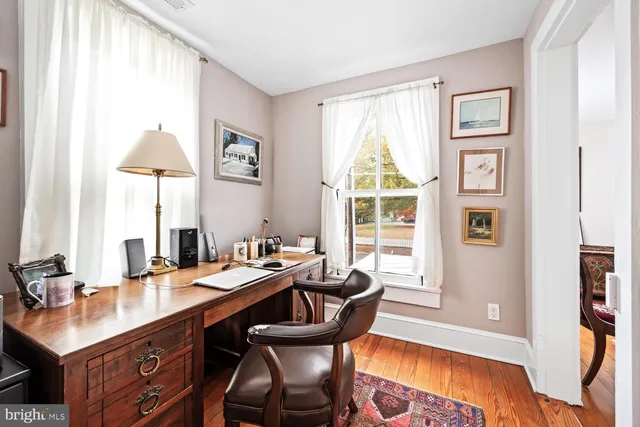 a bedroom with a bed and a mirror