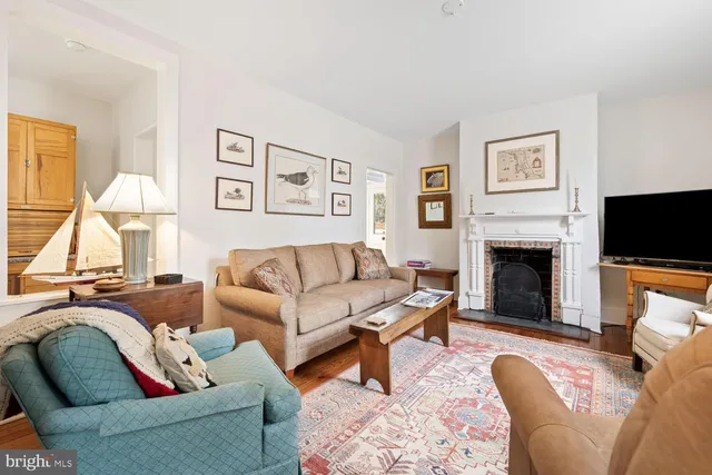 a living room with furniture a bookshelf and a bookshelf