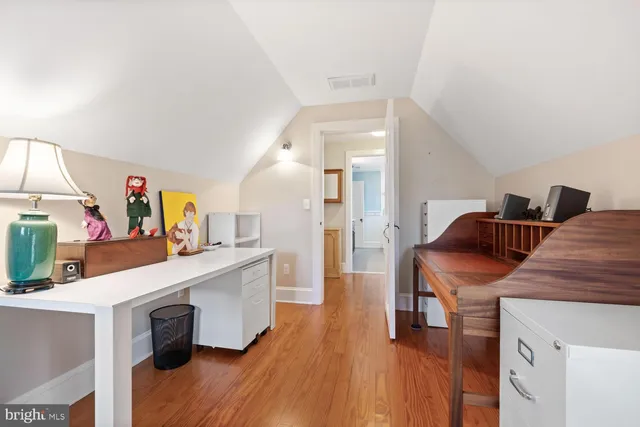 a view of a lake with houses in back