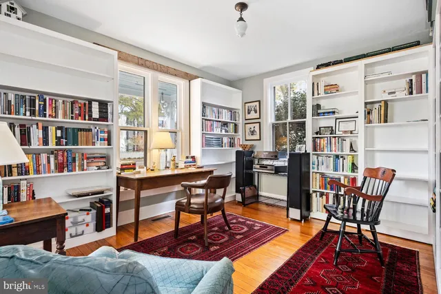 a view of a dining room with furniture and window