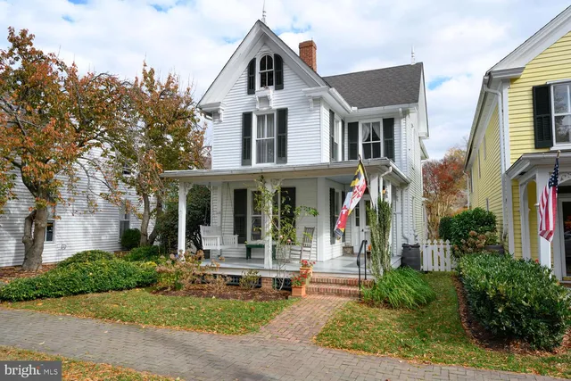 a view of a yard with large trees