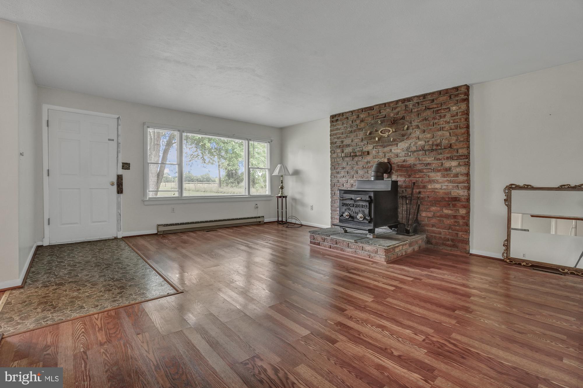 21401 West Offutt Road Poolesville, MD 20837 - Photo 22 of 49 Large living room with fully functional wood stove