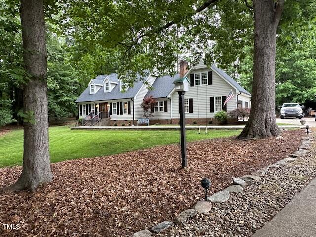 1905 Topsfield Court Raleigh, NC 27615 - Photo 1 of 45 a front view of a house with garden