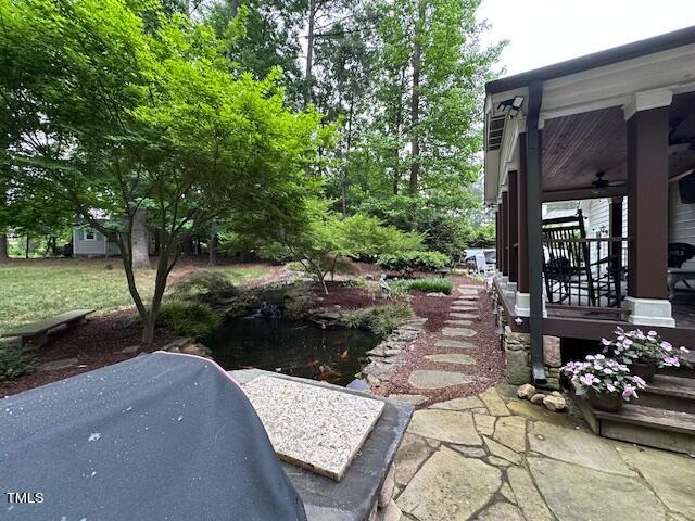 1905 Topsfield Court Raleigh, NC 27615 - Photo 12 of 45 a view of a patio with table and chairs and potted plants