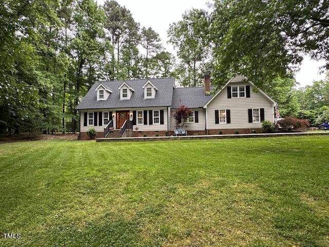 1905 Topsfield Court Raleigh, NC 27615 - Photo 2 of 45 a front view of a house with a yard table and chairs